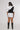 girl wearing your story unisex vest with white tshirt backside view design