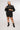 girl wearing the unapologetic unisex back shirt frontside view design