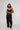 girl wearing journey of curves unisex black trousers front view design