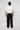 man wearing journey of curves unisex black trousers back view design