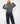 girl wearing charcoal strip unisex hoodie back side view