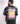 man wearing KARMA’S CHILD UNISEX T-SHIRT black color back side view
