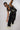 boy dancing on wear be you unisex vest front view