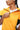 girl wearing honey yellow unisex sweater vest close view